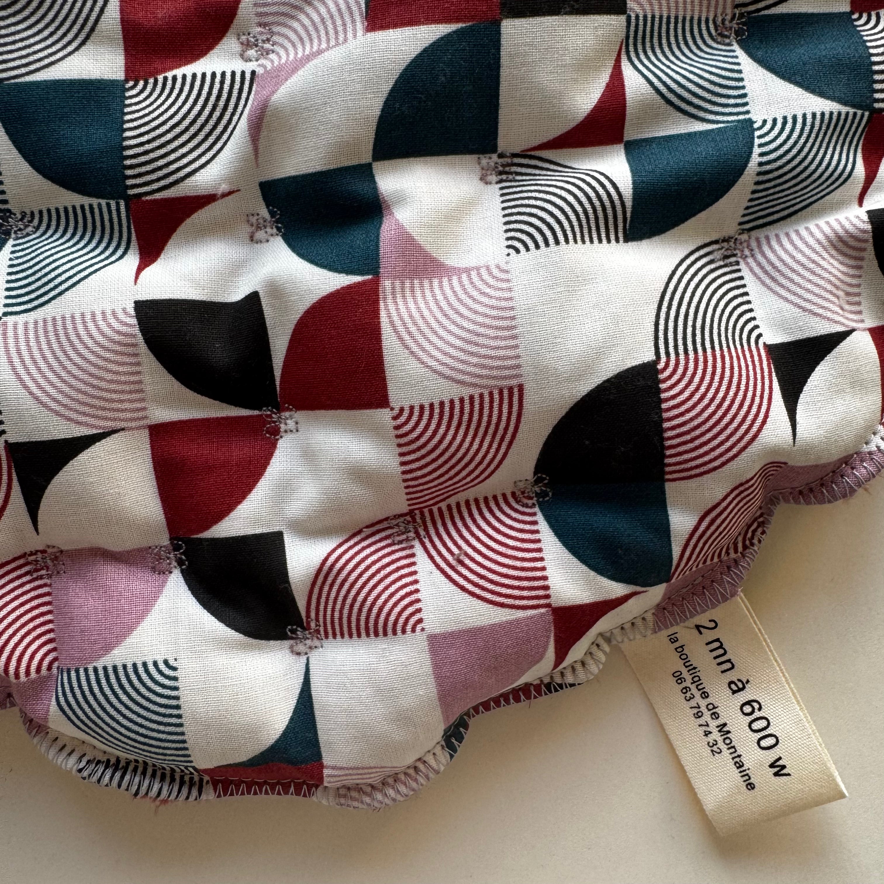 Bouillotte tour de cou motif graphique